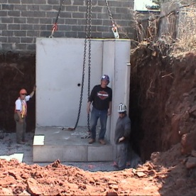 Innovative pre-cast concrete retaining wall segments for urban project  being installed (part of our 'Value Engineering' saving the customer @ $250,000)