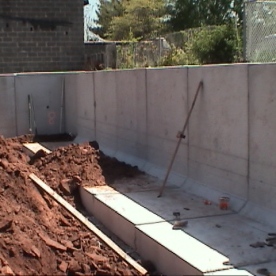 Innovative pre-cast concrete retaining wall segments for urban project  being installed (part of our 'Value Engineering' saving the customer @ $250,000)