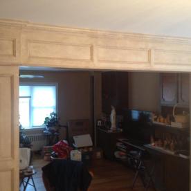 Custom paneled archway with faux paint effect