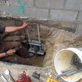 Helical piling foundation reinforcement on an existing waterfront home