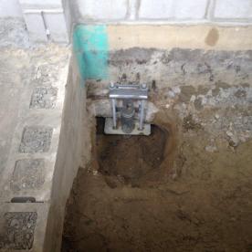 Helical piling foundation reinforcement on an existing waterfront home