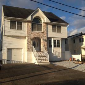 House elevation completed front yard view