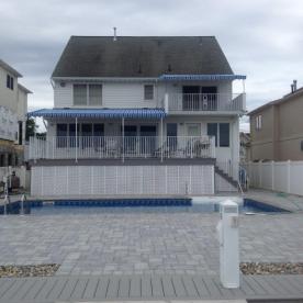 Waterfront home elevation completed rear yard view