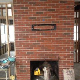 Multi-family Superstorm Sandy restoration,  fireplace after initial demolition